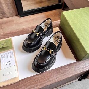 Gucci Women's Black Loafers with Gold Hardware